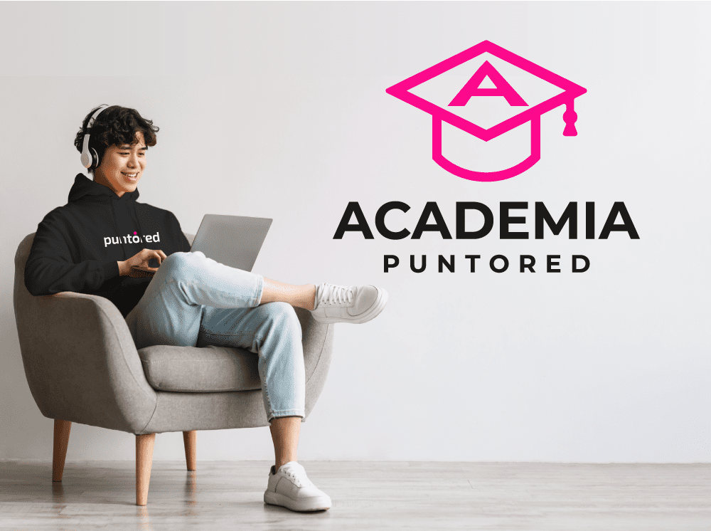 A man sitting in a chair with a laptop.